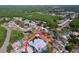 An aerial shot showcases a charming community, featuring homes and serene views of the surrounding landscape at 5249 Wellfield Rd, New Port Richey, FL 34655