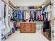 Spacious walk-in closet with custom shelving and ample storage space at 5249 Wellfield Rd, New Port Richey, FL 34655