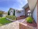 Well-manicured front yard with walkway to the front entrance with mature landscaping at 5249 Wellfield Rd, New Port Richey, FL 34655