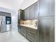 Updated kitchen featuring stainless steel refrigerator and hardware, backsplash, ample storage, and modern finishes at 5249 Wellfield Rd, New Port Richey, FL 34655