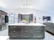 Modern kitchen with a large island, stainless steel appliances, and ample cabinet space at 5249 Wellfield Rd, New Port Richey, FL 34655