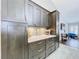 The kitchen showcases new hardware, backsplash, ample storage, and modern finishes at 5249 Wellfield Rd, New Port Richey, FL 34655