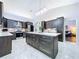 Spacious kitchen offers a large island, stainless steel appliances, and seamless flow into the living spaces at 5249 Wellfield Rd, New Port Richey, FL 34655