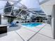 Bright pool area with lounge seating, ideal for enjoying sunny days at 5249 Wellfield Rd, New Port Richey, FL 34655