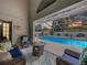 A delightful lanai provides an intimate sitting area looking out onto a sparkling pool and picturesque sunset view at 5249 Wellfield Rd, New Port Richey, FL 34655