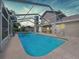 An enclosed outdoor swimming pool offers a private and refreshing experience at 5249 Wellfield Rd, New Port Richey, FL 34655