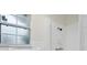 Tiled bathroom with a window and a shower at 5323 23Rd St, Zephyrhills, FL 33542
