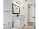 Stylish bathroom with modern vanity, white tiled walls, and updated fixtures at 5323 23Rd St, Zephyrhills, FL 33542