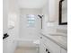 Updated bathroom features modern fixtures and white tiled walls at 5323 23Rd St, Zephyrhills, FL 33542