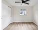 Bedroom with wood floors and closet at 5323 23Rd St, Zephyrhills, FL 33542