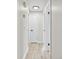 Hallway featuring wood floors and clean neutral paint at 5323 23Rd St, Zephyrhills, FL 33542