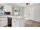 Eat in kitchen features white cabinets, updated appliances, and natural lighting at 5323 23Rd St, Zephyrhills, FL 33542