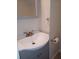 Well-lit bathroom featuring a stylish vanity with a modern faucet and ample storage space at 5708 Townhouse Dr # 5708, New Port Richey, FL 34652