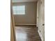 Bedroom featuring a window and wood flooring at 5708 Townhouse Dr # 5708, New Port Richey, FL 34652