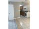 Practical kitchen area includes washer, dryer, ample cabinet space, and tile flooring for easy cleaning at 5708 Townhouse Dr # 5708, New Port Richey, FL 34652