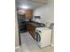 Functional kitchen area features modern appliances, ample storage, and tile flooring for easy maintenance at 5708 Townhouse Dr # 5708, New Port Richey, FL 34652
