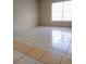 Bright living room with tile floors and a large window offering plenty of natural light at 5708 Townhouse Dr # 5708, New Port Richey, FL 34652