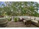 Charming back deck overlooking water offers comfortable seating, a dining area, and beautiful scenery at 6046 River Rd, New Port Richey, FL 34652
