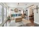 Cozy sitting room features hardwood floors, inviting furniture, and a seamless flow into the adjacent kitchen at 6046 River Rd, New Port Richey, FL 34652