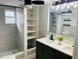 Stylish bathroom features a walk-in shower, updated vanity, and a coordinated neutral color palette at 6108 Maplewood Dr, New Port Richey, FL 34653