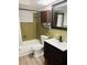 Bathroom with tub/shower combo, unique wood cabinet and updated sink at 6108 Maplewood Dr, New Port Richey, FL 34653