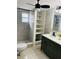 Updated bathroom showcases a walk-in shower, contemporary vanity, and new shelving at 6108 Maplewood Dr, New Port Richey, FL 34653