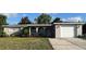 Charming single-story home with a well-maintained lawn and inviting curb appeal at 6108 Maplewood Dr, New Port Richey, FL 34653