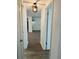 Hallway featuring wood-look flooring and access to living areas at 6108 Maplewood Dr, New Port Richey, FL 34653