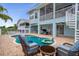 Stunning backyard with a private pool, patio, spiral staircase, and upper level deck, perfect for entertaining and relaxation at 6140 Seaside Dr, New Port Richey, FL 34652
