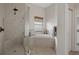 Bright bathroom featuring a walk-in shower and soaking tub at 6140 Seaside Dr, New Port Richey, FL 34652