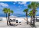 View of beach cabana with picnic tables and a grill with the ocean in the background at 6140 Seaside Dr, New Port Richey, FL 34652