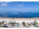Aerial shot of a beach with picnic cabanas and palm trees along the shore at 6140 Seaside Dr, New Port Richey, FL 34652