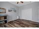Cozy bedroom featuring stylish wood-look flooring and neutral gray walls creating a serene and comfortable retreat at 6140 Seaside Dr, New Port Richey, FL 34652