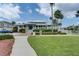 Manicured lawns surround the community center, complete with lush tropical landscaping at 6140 Seaside Dr, New Port Richey, FL 34652