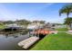 Private boat dock with multiple slips, providing easy access to the waterfront and boating activities at 6140 Seaside Dr, New Port Richey, FL 34652