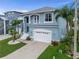 Inviting two-story home with a two-car garage, balcony, and well-maintained lawn at 6140 Seaside Dr, New Port Richey, FL 34652