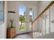 Inviting home foyer with view to the outside and features a small wooden cabinet at 6140 Seaside Dr, New Port Richey, FL 34652
