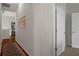 Bright hallway with hardwood floors, neutral walls, decorative rug, and recessed lighting creates a welcoming and well-lit space at 6140 Seaside Dr, New Port Richey, FL 34652