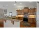 Spacious kitchen with granite countertops, stainless steel appliances, and custom wood cabinets at 6140 Seaside Dr, New Port Richey, FL 34652
