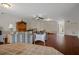 Bright living room with hardwood floors, comfortable seating, and a view of the bar area at 6140 Seaside Dr, New Port Richey, FL 34652