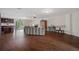 Spacious living room featuring hardwood floors, neutral walls, and recessed lighting creating an open and inviting atmosphere at 6140 Seaside Dr, New Port Richey, FL 34652