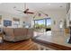 Open living area with a comfortable sofa, stylish furnishings, and a clear view to the outdoor patio at 6140 Seaside Dr, New Port Richey, FL 34652