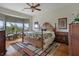 Bedroom with a large bay window and a king-sized bed with tropical-themed bedding at 6140 Seaside Dr, New Port Richey, FL 34652