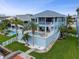 The backyard features a pool, an outdoor patio with a spiral staircase, and lush landscaping at 6140 Seaside Dr, New Port Richey, FL 34652