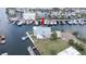 An aerial view of the waterfront home showing the dock, canal access, and manicured lawn at 6322 Aureau Ave, Hudson, FL 34667