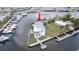 Aerial view of waterfront home showcasing the boat dock, canal access, and lush landscaping at 6322 Aureau Ave, Hudson, FL 34667