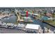 Bird's-eye view of waterfront residence with private dock, nestled in a canal community at 6322 Aureau Ave, Hudson, FL 34667