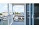 Balcony view overlooking the canal with docked boats, perfect for relaxation at 6322 Aureau Ave, Hudson, FL 34667