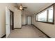 Bedroom with a large window, carpet flooring, ceiling fan and marina view at 6322 Aureau Ave, Hudson, FL 34667