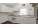 Well-maintained kitchen featuring white cabinets and modern appliances at 6322 Aureau Ave, Hudson, FL 34667